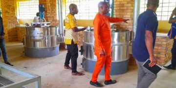 West Gonja MCE, 1D1F beneficiaries and Rural enterprise officers inspects fitted equipment at 1d1f factory.